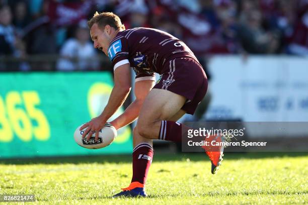 Daly Cherry-Evans of the Sea Eagles scores a try during the round 22 NRL match between the Manly Warringah Sea Eagles and the Sydney Roosters at...