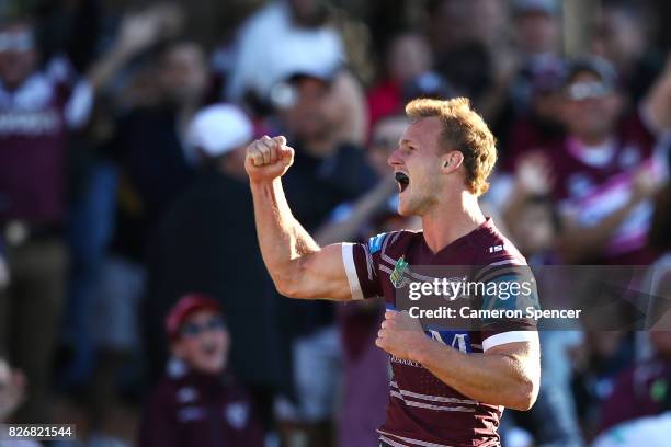 Daly Cherry-Evans of the Sea Eagles celebrates scoring a try during the round 22 NRL match between the Manly Warringah Sea Eagles and the Sydney...