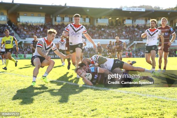 Bradley Parker of the Sea Eagles scores a try during the round 22 NRL match between the Manly Warringah Sea Eagles and the Sydney Roosters at...