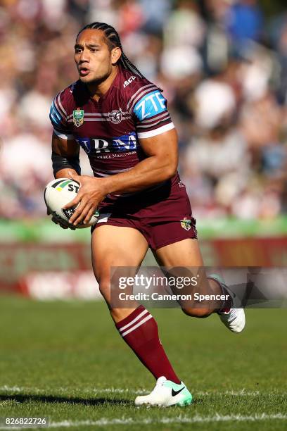 Martin Taupau of the Sea Eagles runs the ball during the round 22 NRL match between the Manly Warringah Sea Eagles and the Sydney Roosters at...