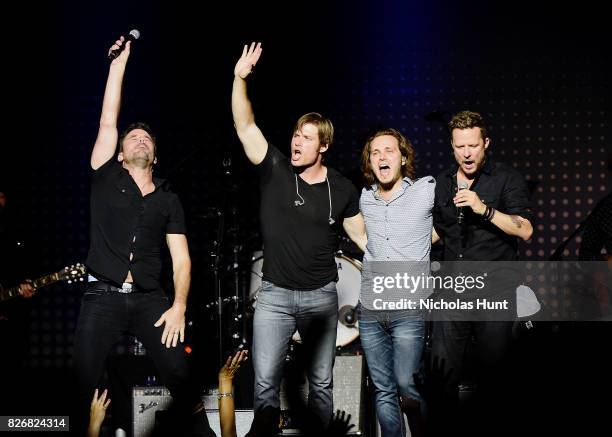 Charles Esten, Chris Carmack, Jonathan Jackson and Will Chase perform during the Concert for the CMT Series "Nashville" at Ford Amphitheater at Coney...