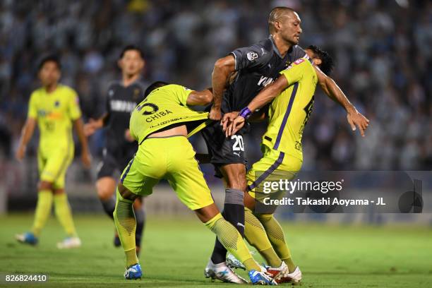 Kengo Kawamata of Jubilo Iwata, Hiroki Mizumoto and Nagisa Sakurauchi of Jubilo Iwata tussle during the J.League J1 match between Jubilo Iwata and...