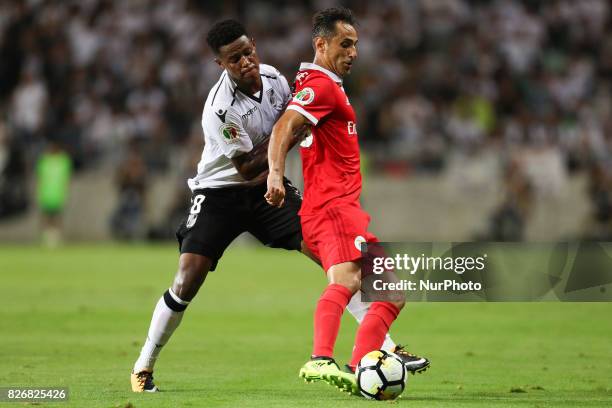 Benfica's Brazilian forward Jonas vies with Vitoria SC's South Africa midfielder Bongani Zungu during the Candido Oliveira Super Cup match between SL...