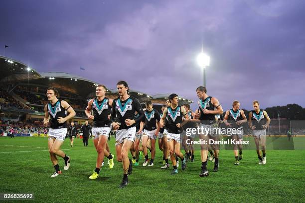 Power players run from the field at half time during the round 20 AFL match between the Adelaide Crows and the Port Adelaide Power at Adelaide Oval...