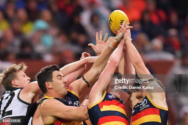 Players compete for the ball during the round 20 AFL match between the Adelaide Crows and the Port Adelaide Power at Adelaide Oval on August 6, 2017...