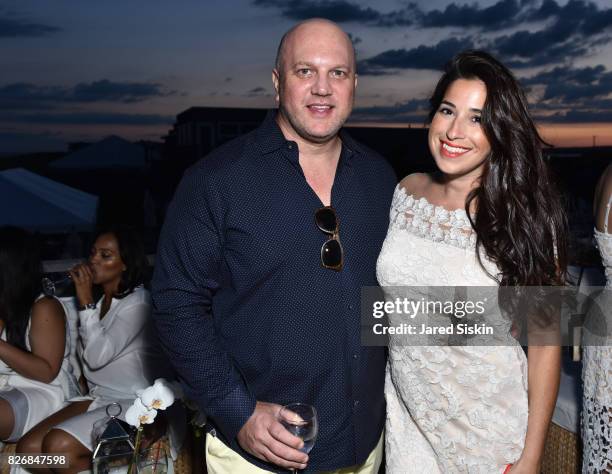 Zvi Cole and Joianne Calderaro attend Women's Health and FEED's 6th Annual Party Under the Stars at Bridgehampton Tennis and Surf Club on August 5,...