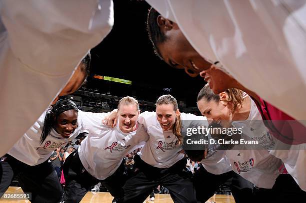 The San Antonio Silver Stars wears a special pink T-shirts to promote breast health awareness in their game against the Los Angeles Sparks on...