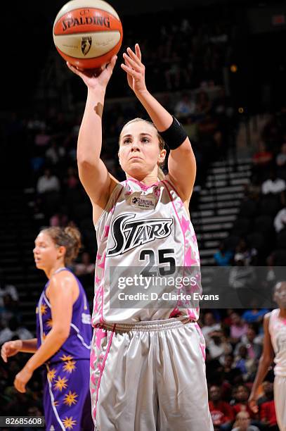 Becky Hammon of the San Antonio Silver Stars wears a special pink jersey to promote breast health awareness in their game against the Los Angeles...