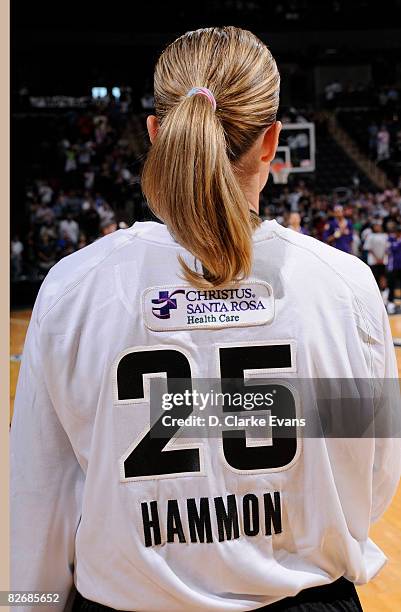 Becky Hammon of the San Antonio Silver Stars wears a special pink t-shirt to promote breast health awareness in their game against the Los Angeles...