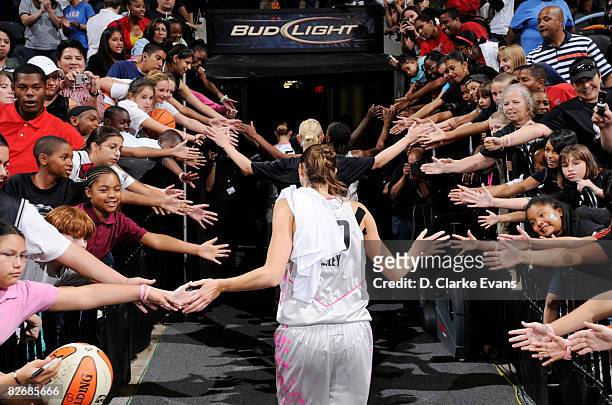 San Antonio Silver Stars fans reach for the Stars after their game against the Los Angeles Sparks on September 5, 2008 at the AT&T Center in San...