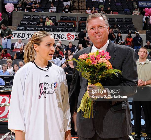 Becky Hammon of the San Antonio Silver Stars receives flowers from Dan Hughes, Head Coach in honor of her Olympic Bronze Medal prior to the game...