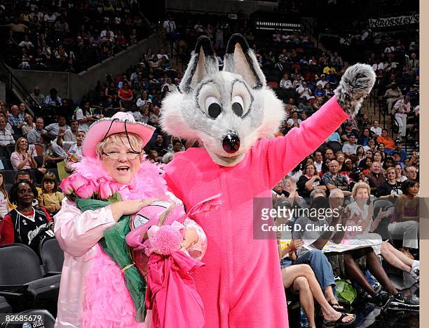The San Antonio Silver Stars Fox wears a special pink outfit to promote breast health awareness and honors a cancer survivor in their game against...