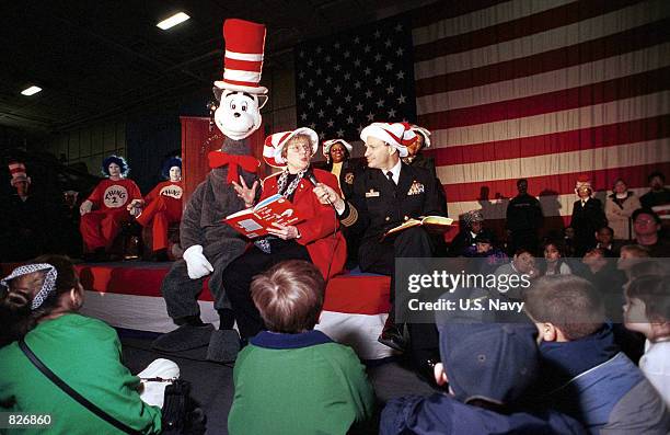 Capt. David R. Bryant, Commanding Officer of the aircraft carrier USS Theodore Roosevelt and Ms. Jean Bankos , president of the Virginia Education...