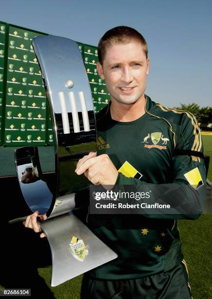 Michael Clarke of Australia holds the Commonwealth Bank Trophy after winning the third one day international match between Australia and Bangladesh...