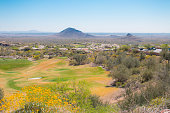 op view of golf course  in desert landscape.