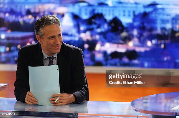 Host Jon Stewart of Comedy Central's "The Daily Show with Jon Stewart" watches a video while taping "The Daily Show with Jon Stewart: Restoring Honor...