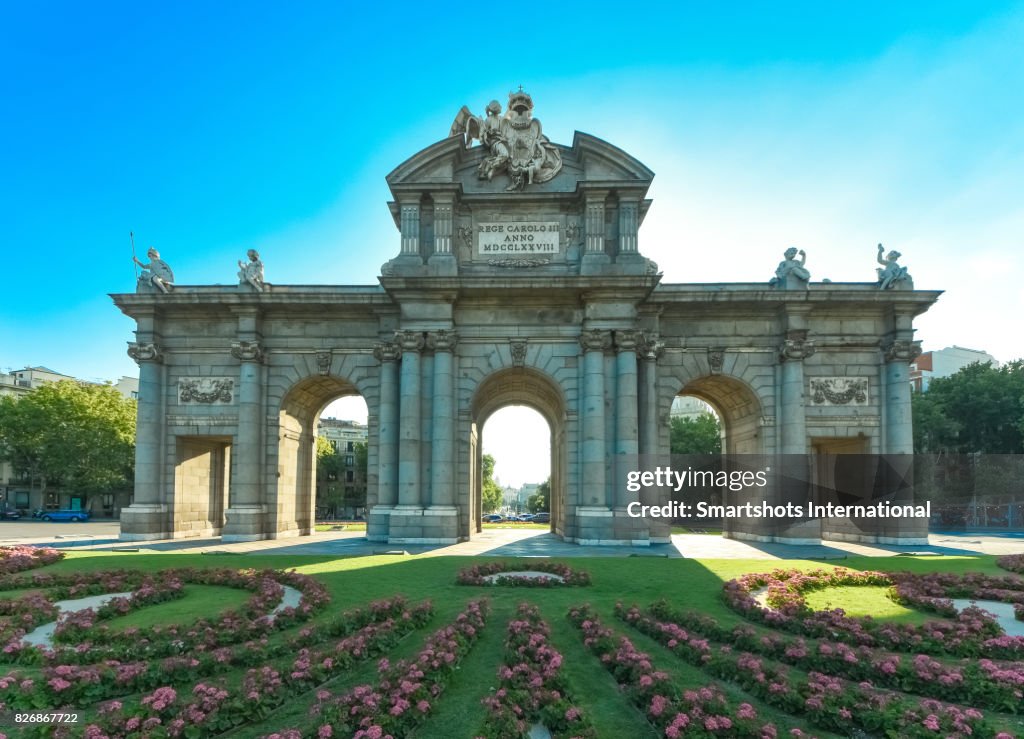 Alcala Gate backlit on a hot summer afternoon in Madrid, Spain