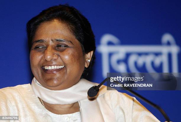 Chief Minister of the Indian state of Uttar Pradesh and President of the Bahujan Samaj Party Mayawati smiles as she addresses a press conference in...