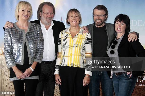 Composers Bjorn Ulvaeus and Benny Anderson of the Swedish group Abba pose with British playwrier Catherine Johnson and producer Judy Cramer during...