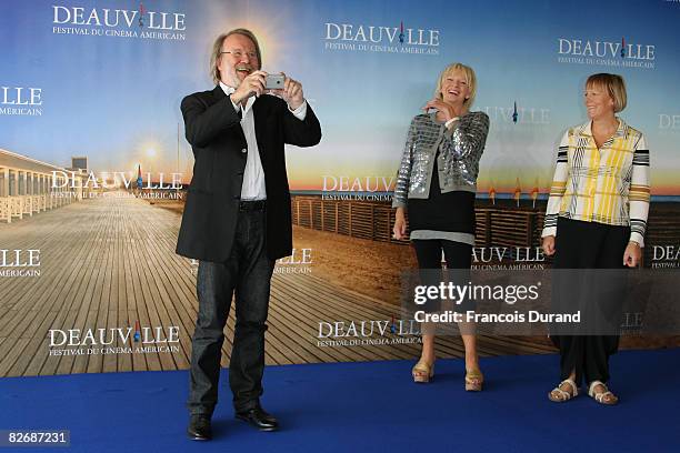 Composer Benny Anderson of the Swedish group Abba takes a picture of photographers and cameramen with his mobile phone at the photocall of 'Mamma Mia...