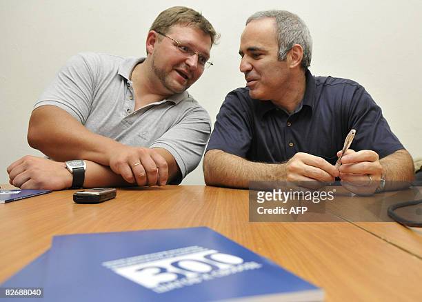 Russian opposition politicians Nikita Belykh and Garry Kasparov speak at a press conference in Moscow on September 6, 2008. The two presented their...