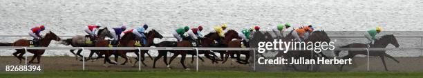 Runners head down the back straight in totescoop6 London Mile Heritage Handicap Stakes Race run at Kempton Racecourse on September 6 in Kempton,...