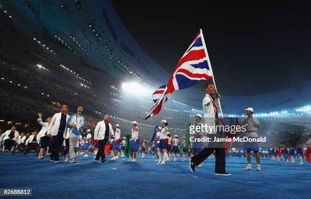 Daniel Crates of the GB Athletics Team walks with the British flag during the Opening Ceremony for the Beijing 2008 Paralympic Games at the National...