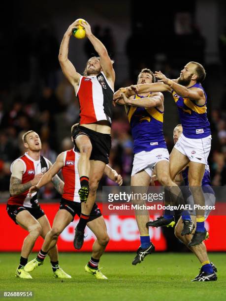 Josh Bruce of the Saints marks the ball against Will Schofield of the Eagles during the round 20 AFL match between the St Kilda Saints and the West...