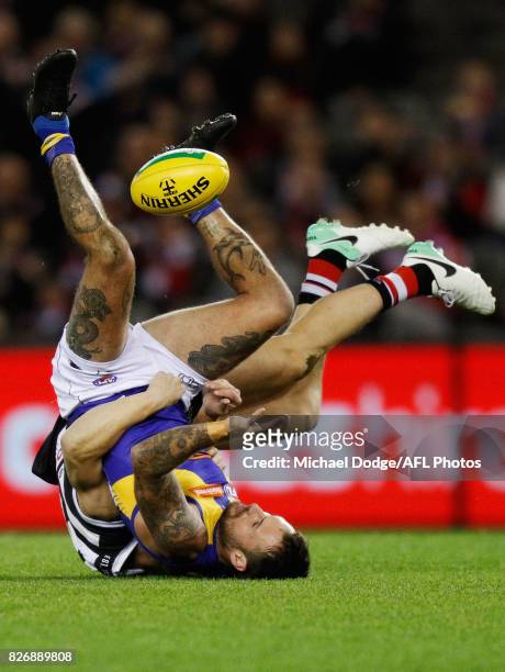 Chris Masten of the Eagles is tackled by Luke Dunstan of the Saints during the round 20 AFL match between the St Kilda Saints and the West Coast...