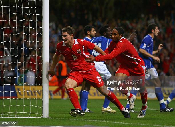 Sam Vokes of Wales celebrates with Ashley Williams after scoring for Wales during the FIFA 2010 World Cup Group Four Qualifying match between Wales...