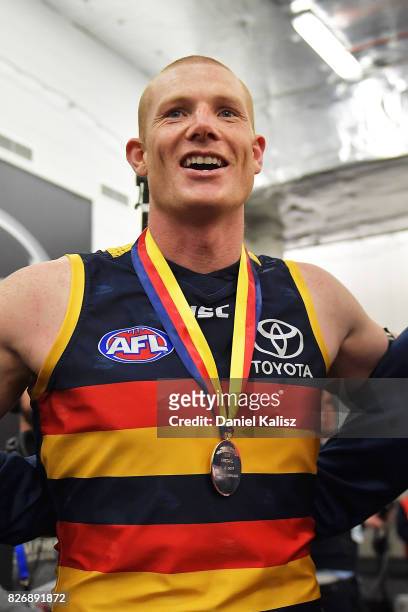 Sam Jacobs of the Crows sings the club song after the round 20 AFL match between the Adelaide Crows and the Port Adelaide Power at Adelaide Oval on...
