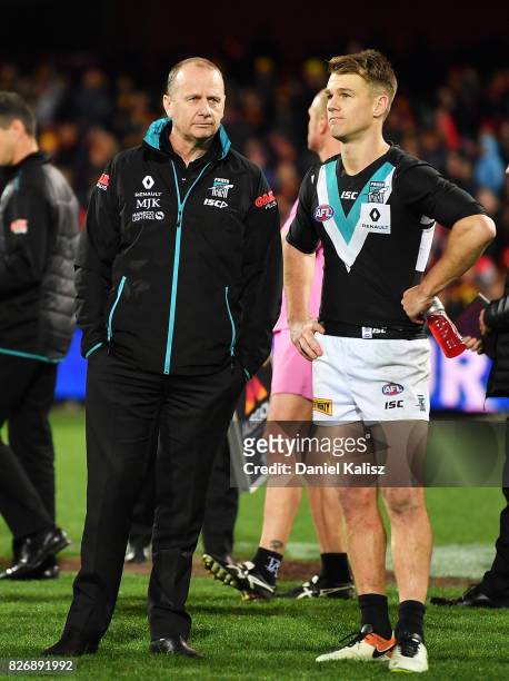 Ken Hinkley the coach of the Power and Robbie Gray of the Power look on after the round 20 AFL match between the Adelaide Crows and the Port Adelaide...