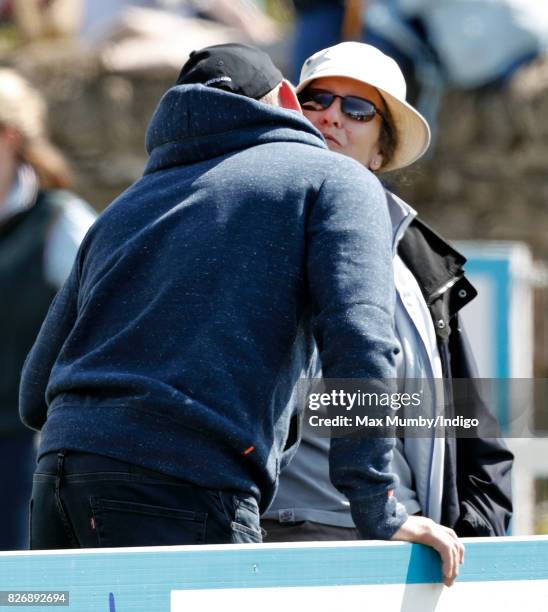 Mike Tindall kisses Princess Anne, The Princess Royal as they attend day 2 of the Festival of British Eventing at Gatcombe Park on August 5, 2017 in...