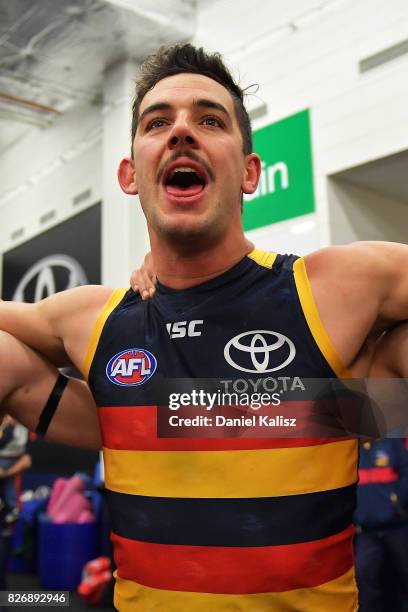 Taylor Walker of the Crows sings the club song after the round 20 AFL match between the Adelaide Crows and the Port Adelaide Power at Adelaide Oval...