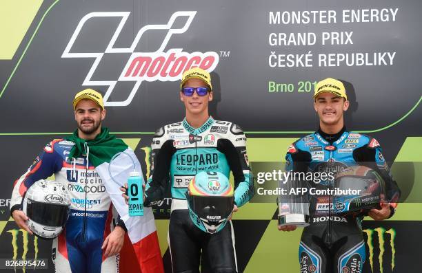 Second placed Romano Fenati of Italy, winner Joan Mir of Spain and third placed Aron Canet of Spain pose on podium after the Moto3 event of the Grand...