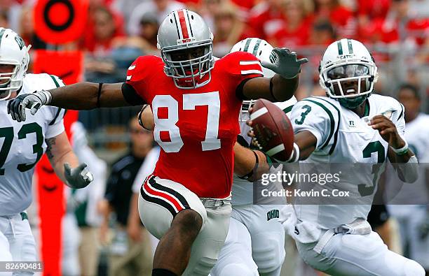 Defensive lineman Lawrence Wilson of the Ohio State Buckeyes gives chase to quarterback Theo Scott of the Ohio Bobcats during the game at Ohio...