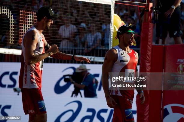 Clemens Doppler and Alexander Horst of Austria celebrate during Day 9 of the FIVB Beach Volleyball World Championships 2017 on August 5, 2017 in...