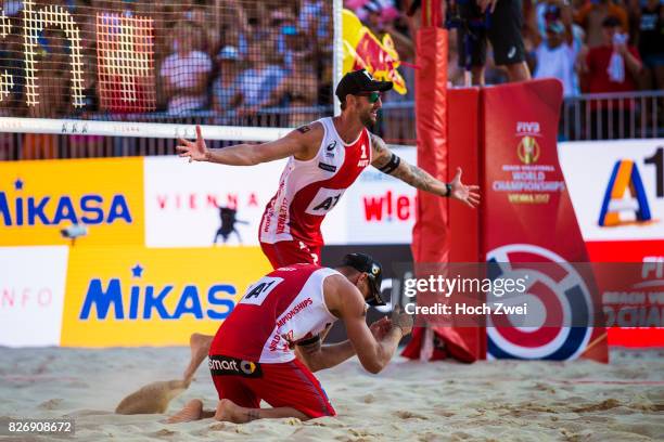 Clemens Doppler and Alexander Horst of Austria celebrate during Day 9 of the FIVB Beach Volleyball World Championships 2017 on August 5, 2017 in...