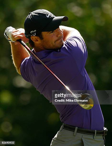Trevor Immelman hits his tee shot on the ninth hole during the weather-delayed second round of the BMW Championship on September 6, 2008 at Bellerive...
