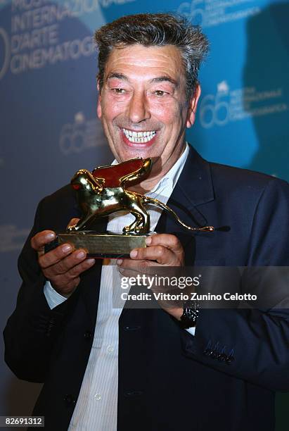 Director Gianni di Gregorio poses with the Opera Prima "Luigi De Laurentiis" Award for the movie "Pranzo di Ferragosto" at the 65th Venice Film...