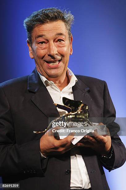Director Gianni di Gregorio poses with the Opera Prima "Luigi De Laurentiis" Award for the movie "Pranzo di Ferragosto" at the 65th Venice Film...
