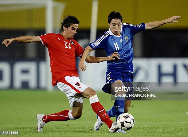 French midfielder Samir Nasri vies with Austrian Martin Harnik during the WC 2010 qualifying football match France vs Austria, on September 6, 2008...