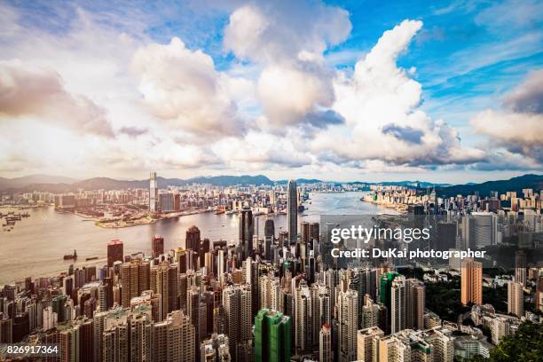 sunset over victoria harbor - kowloon 個照片及圖片檔