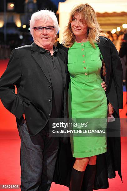 French musician Marc Cerrone poses with his wife Jill upon arrival for the screening of "Hellboy II : The Golden Army", starring US actor Ron...