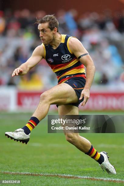 Richard Douglas of the Crows kicks the ball during the round 20 AFL match between the Adelaide Crows and the Port Adelaide Power at Adelaide Oval on...