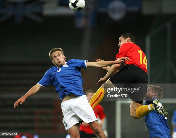 Belgian Thomas Vermaelen and Estonia's Aleksandr Dmitrijev vie for the ball during the World Cup 2010 qualification match Belgium versus Estonia,on...