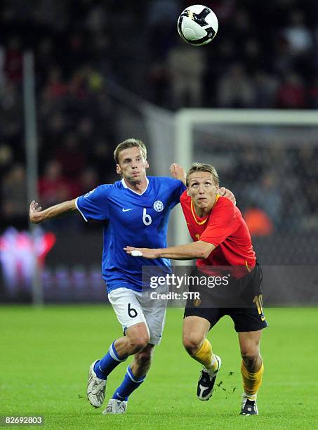 Belgian Wesley Sonck and Estonia's Aleksandr Dmitrijev vie for the ball during the World Cup 2010 qualification match Belgium versus Estonia,on...