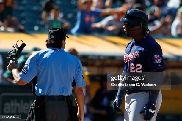 Miguel Sano of the Minnesota Twins argues after being ejected by umpire Phil Cuzzi during the eleventh inning against the Oakland Athletics at the...