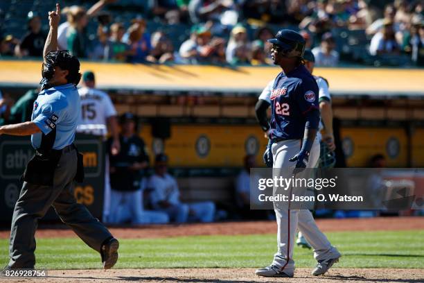 Miguel Sano of the Minnesota Twins is ejected by umpire Phil Cuzzi during the eleventh inning against the Oakland Athletics at the Oakland Coliseum...