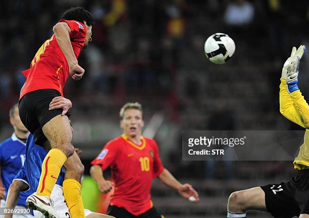 Belgian Marouane Fellaini and Estonia's goalie Pavel Londak vie for the ball during the World Cup 2010 qualification match Belgium versus Estonia,on...